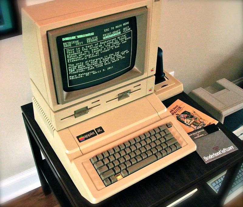 Apple IIe with monochrome display with a dark background and light foreground